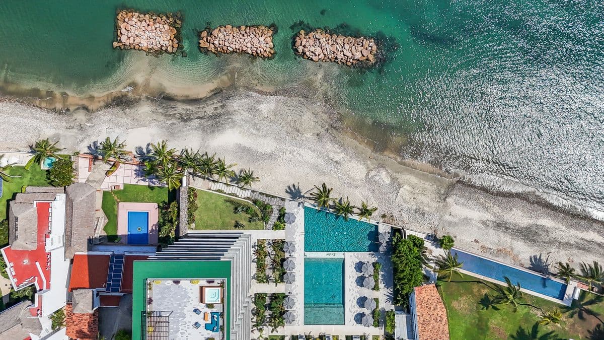 The pool deck and gardens from above · official photography