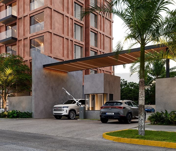 The arrival at The Lighthouse — gatehouse and controlled access beneath the tower, Fluvial Vallarta