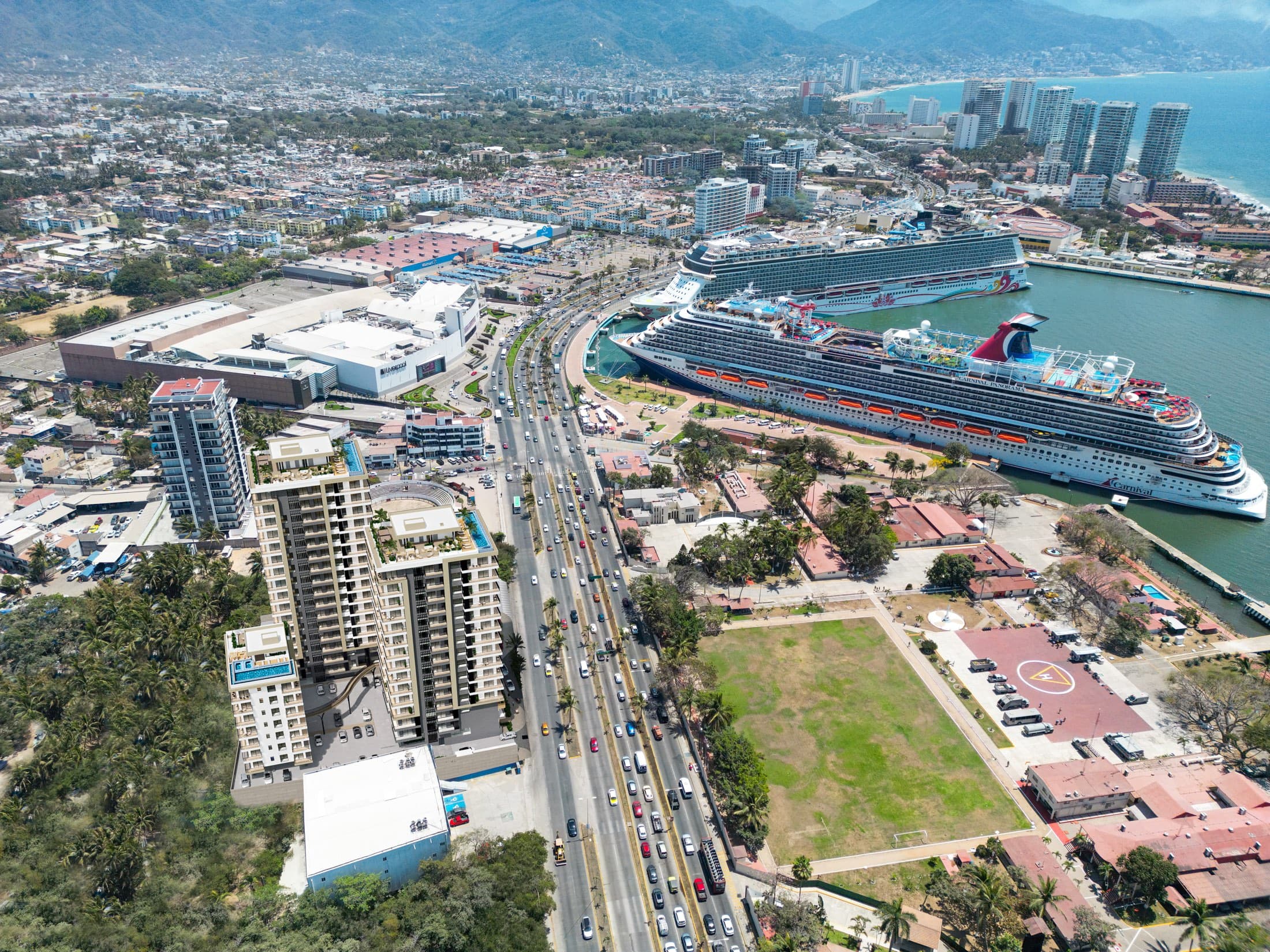 DUE from the air — the towers on Avenida Francisco Medina Ascencio with Puerto Mágico's cruise terminal and Banderas Bay beyond